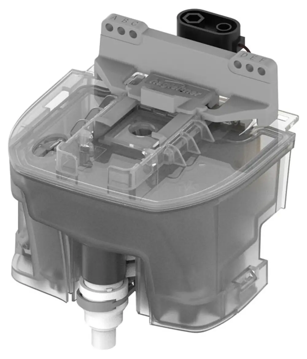 Transparente Pumpeneinheit von Keuco mit elektrischen Anschlüssen und Ventil. Geeignet für Anwendung im Bereich der Sanitärtechnik.
